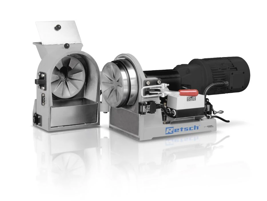 DM 200 disc mill opened to show the grinding discs