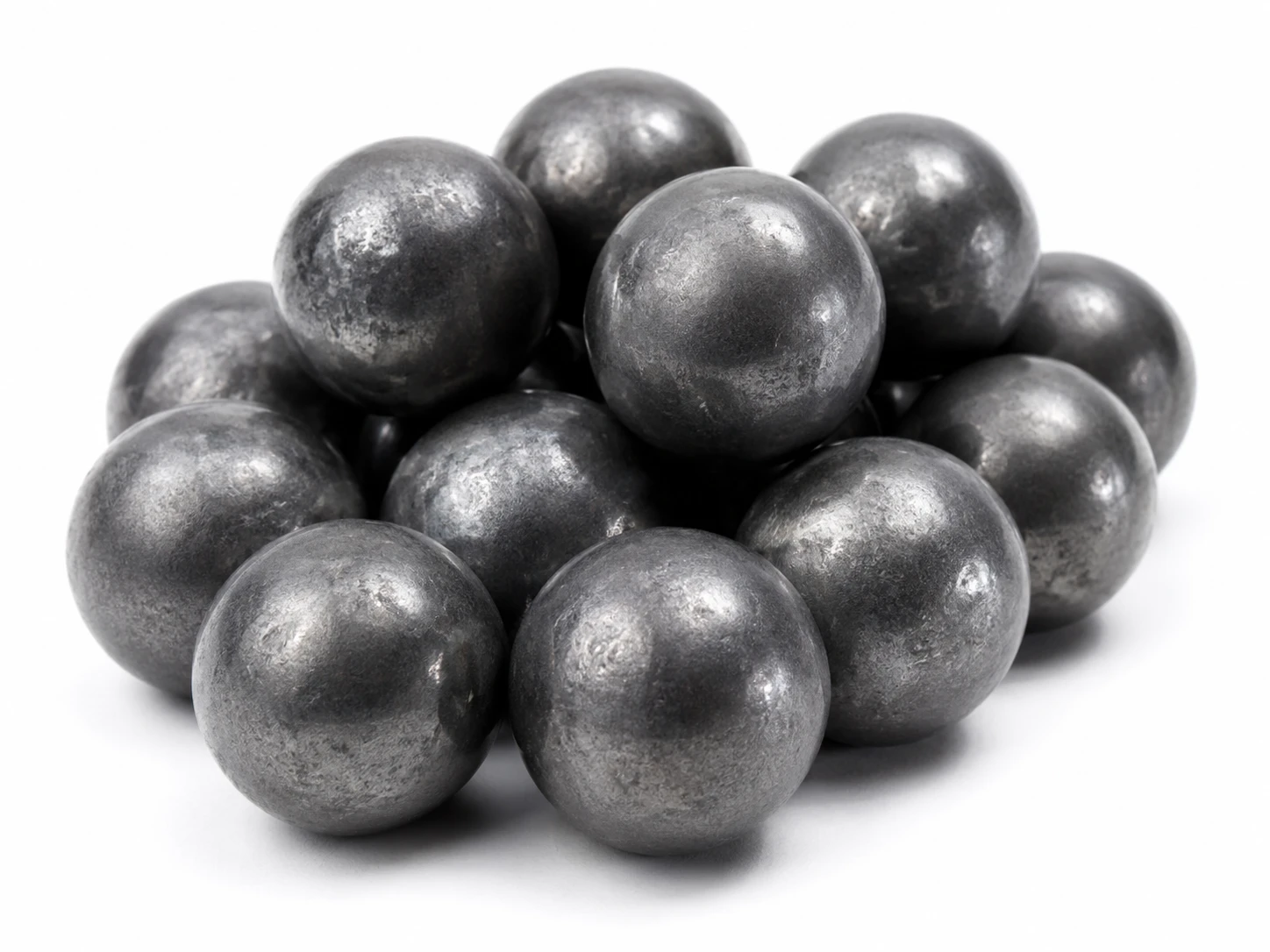 Pile of carbon steel grinding balls for reducing particle size during milling