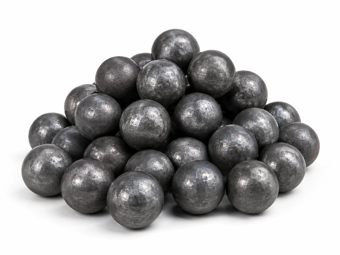 Small pile of carbon steel grinding balls for reducing particle size during milling