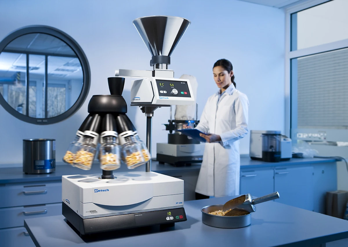 RETSCH PT 100 Sample Divider for splitting samples into representative portions; in a lab with a technician